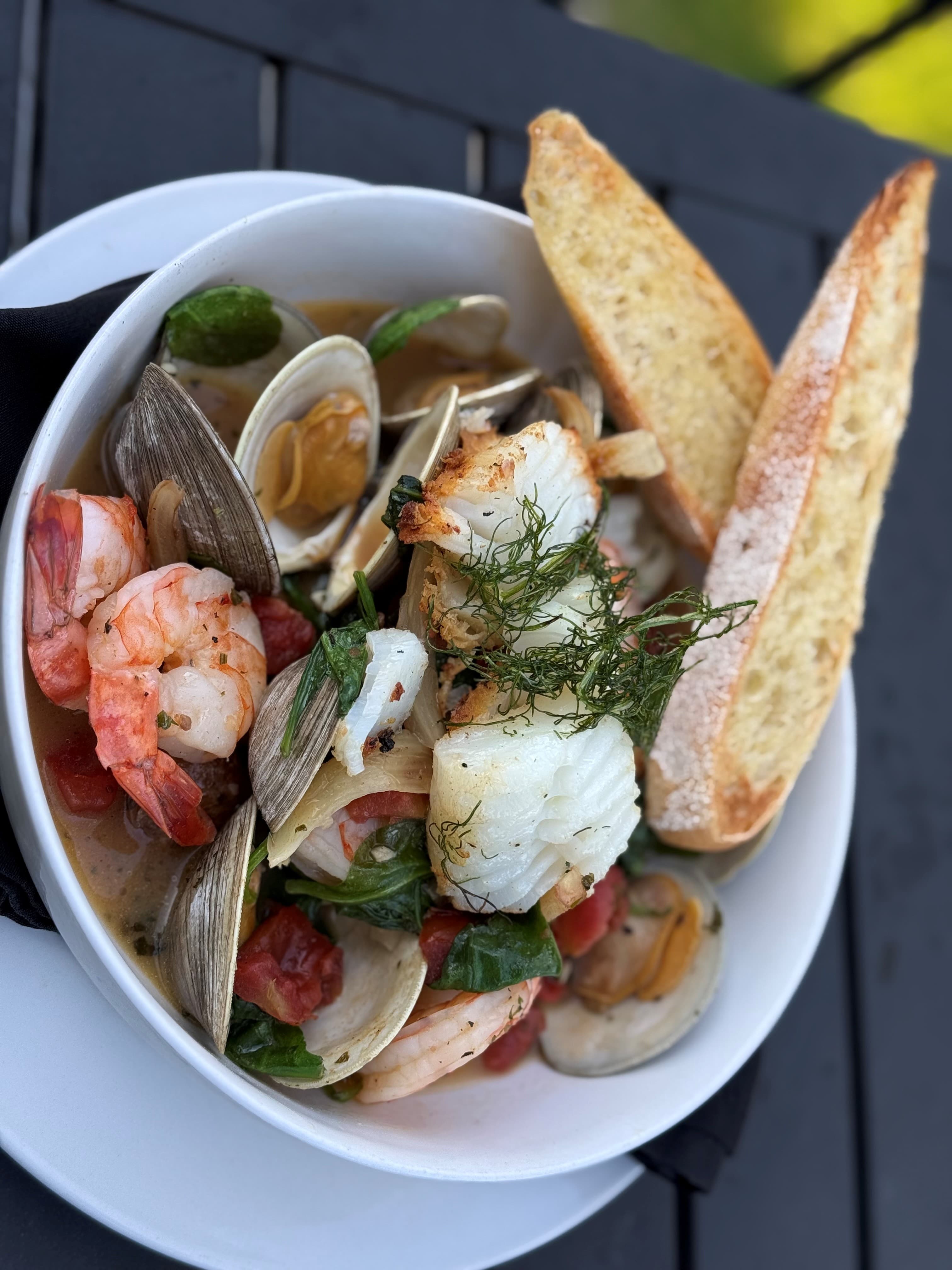 Cioppino — shrimp, cod and clams stewed in a fennel and tomato broth over roasted fingerlings at The Mansard