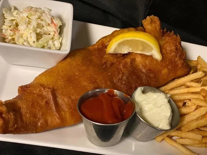 Classic Buffalo-style fish fry with coleslaw and fries